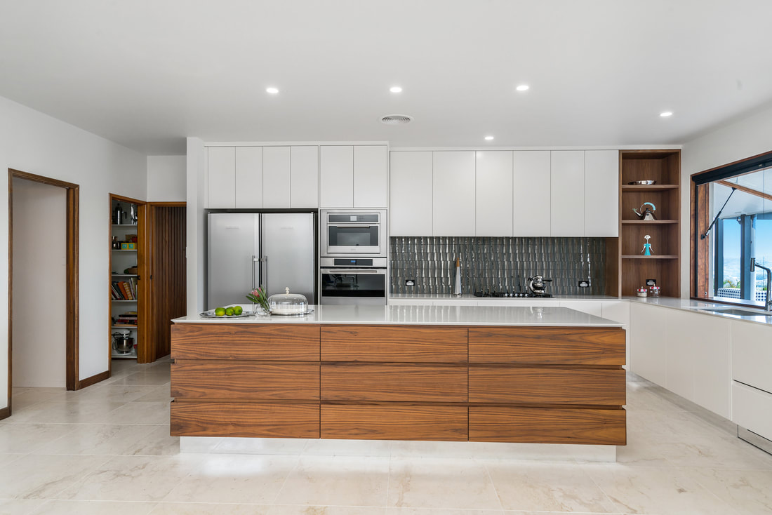 A custom kitchen with a timber island bench built by Design Spec Joinery in Lismore